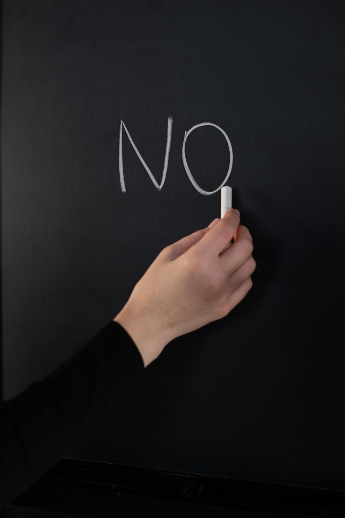 The word no written on a chalkboard