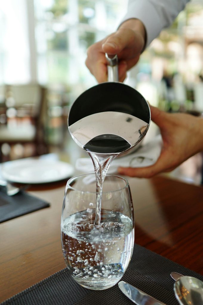 Pouring water out of a pitcher